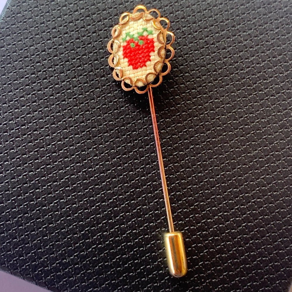 Vintage needlepoint stick pin with a embroidered strawberry design.